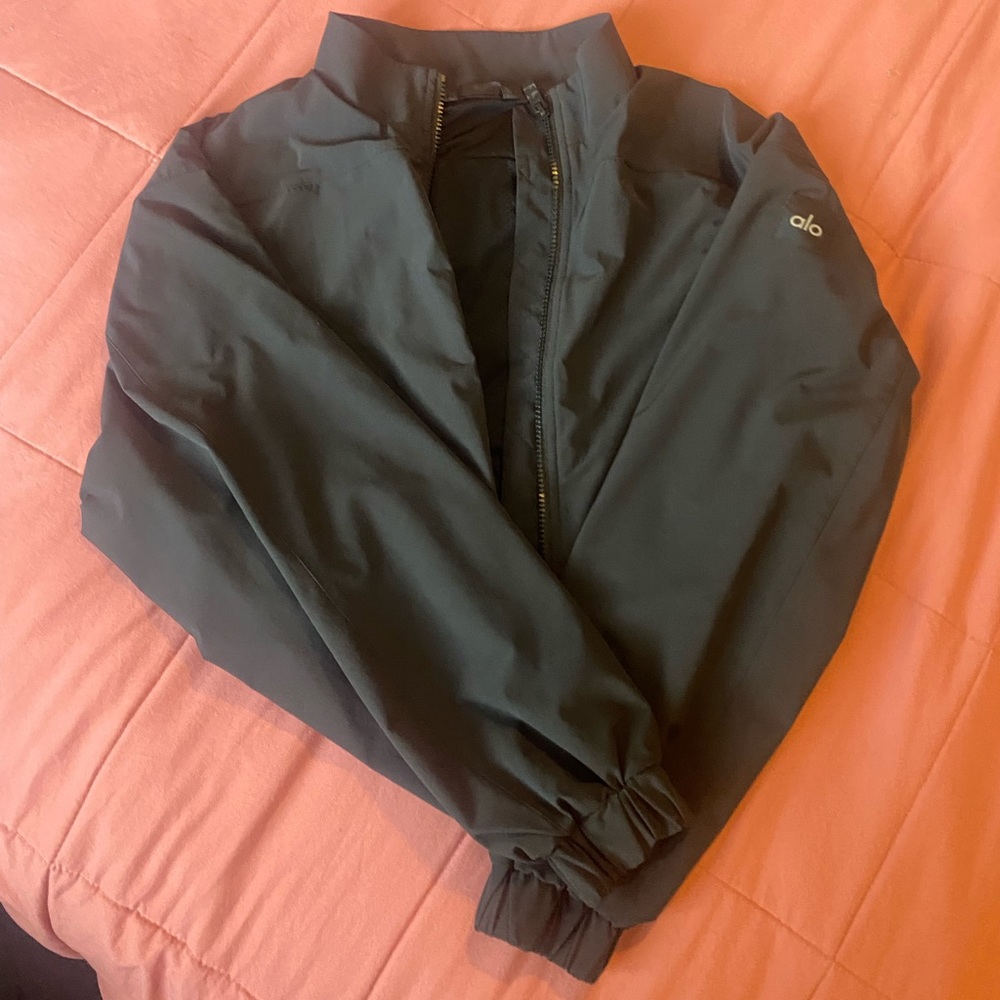 Black cropped Alo jacket.